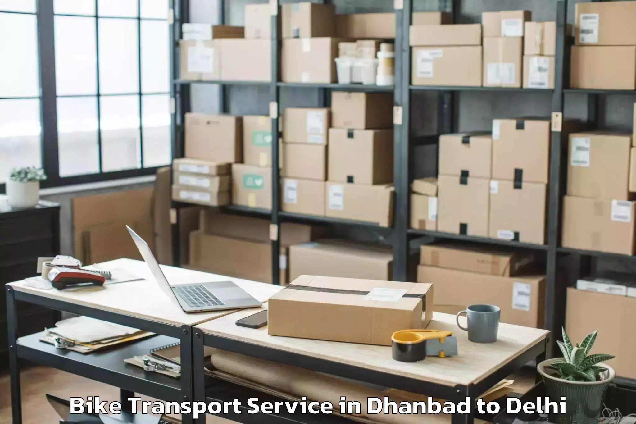 Reliable Dhanbad to Unity One Janakpuri Mall Bike Transport